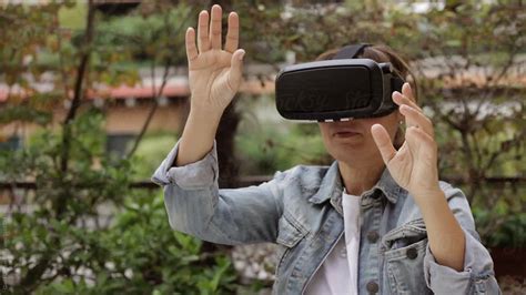 Woman Wearing 3d 360 Vr Glasses Outdoor By Stocksy Contributor Giada