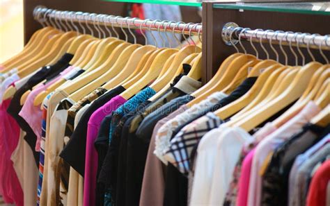 Variety Of Clothes Hanging On Rack Stock Photo Image Of Colorful
