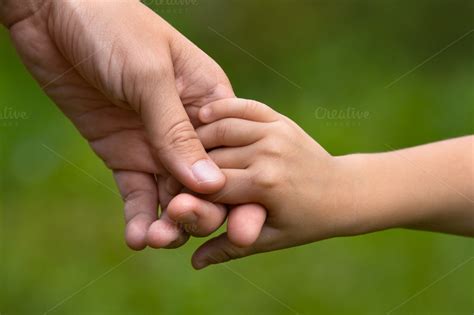Adult Holding A Childs Hand People Photos On Creative Market