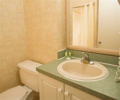Spacious two bedroom/two bath suites and deluxe studio suites with fully equipped kitchenettes and private balconies. Orlando Hotel Suites | Two Bedroom Suite | The Enclave ...