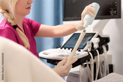 Gynecologist Applies Gel To A Transvaginal Ultrasound Scanner For A Female Vaginal Examination