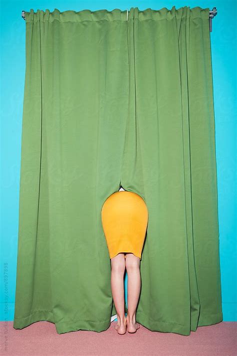 Woman Hiding Behind The Green Curtain By Stocksy Contributor Ulasandmerve Green Curtains
