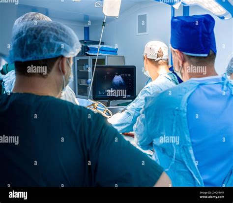 Surgeons Monitor The Condition Of The Patient S Internal Organs During
