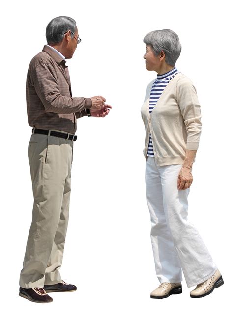 An Older Couple Standing Next To Each Other