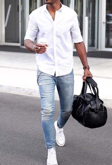The best way to retain whiteness is to launder white items together in the hottest water. Picture Of light blue jeans, a white shirt and white sneakers