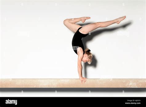 Gymnast 13 15 Doing Handstand On Balance Beam Side View Stock Photo