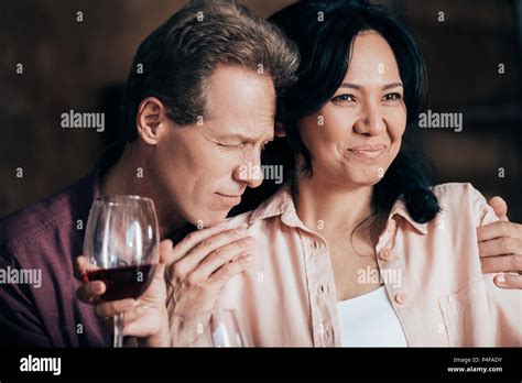 Beautiful Happy Multiethnic Couple Drinking Red Wine Together Stock