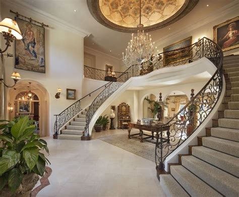 Maybe you would like to learn more about one of these? A grand entrance with dual staircases | Luxury staircase ...