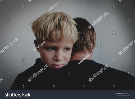 Father Comforting Stressed Crying Sad Son Stock Photo 1195597717