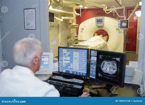 Senior Doctor Checking Computerized Axial Tomography Scan Cat Scan