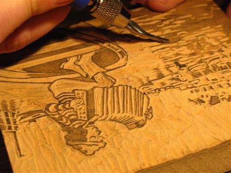 relief printmaking process whereby an impression is created by inking