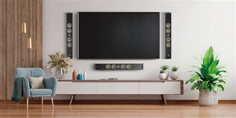 Wall Mounted Speakers Surround The Big Screen Tv With Sound