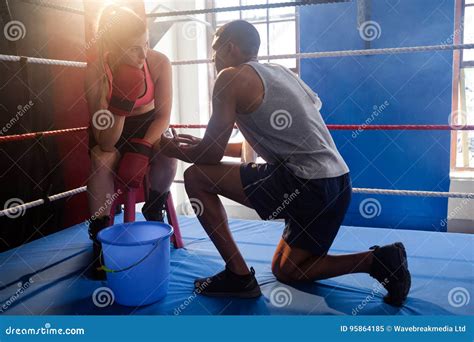 Trainer Assisting Woman In Boxing Stock Image Image Of Focused Coach