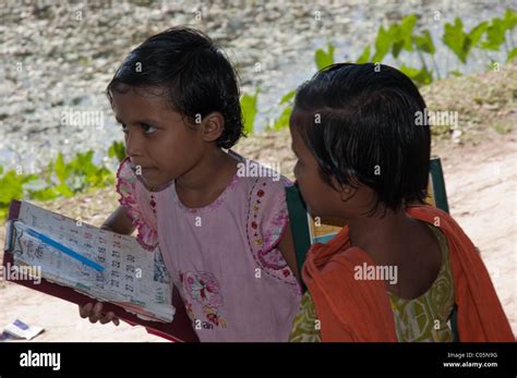 Two Bangladeshi School Children One Clutching Her Schoolwork Stock