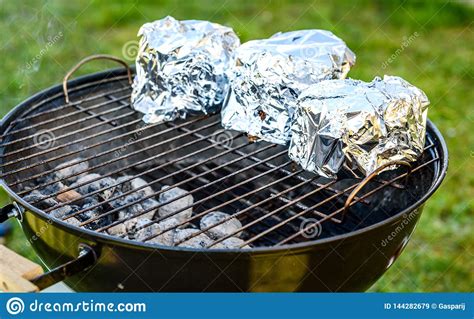 Transfer your cooked pork joint to a warm platter or clean board and cover with foil. Roasting Pork In A Bed Of Kitchen Foil : Grilled Honey ...