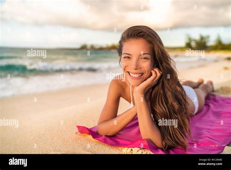 Happy Asian Bikini Wwoman Model Relaxing On Summer Vacation Lying On Beach Towel Hawaii Travel