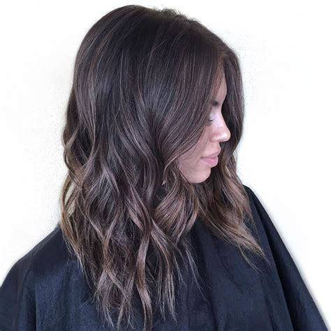 Medium Wavy Brown Hairstyle With Subtle Highlights More Brunette