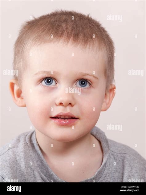 Young Boy With Big Blue Eyes Head And Shoulders Portrait Model Release