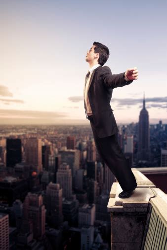 Businessman Standing On Top Of A Building In Ny City Stock Photo