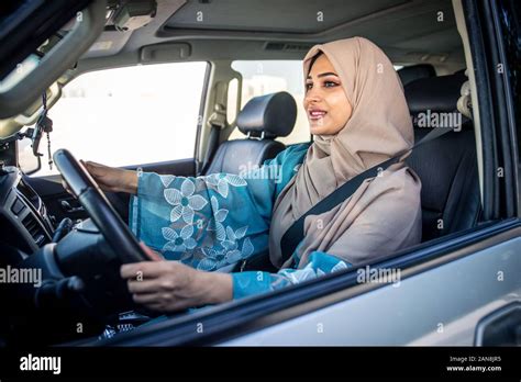 Beautiful Woman In Dubai Wearing Abaya Traditional Female Dress Driving