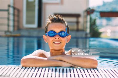 Happy Little Boy Swimming In The Pool High Res Stock Photo Getty Images