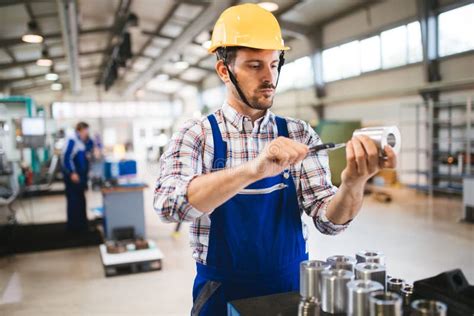 Male Worker And Quality Control Inspection In Factory Stock Image