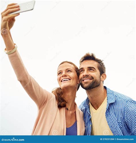 Having A Selfie Moments An Affectionate Couple Taking Selfies Outside