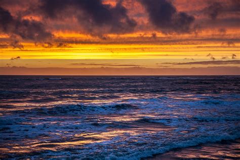 Ocean Waves Crashing The Shore During Sunset · Free Stock Photo