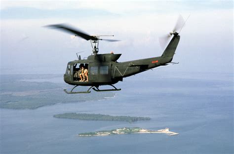 An Air To Air Left Side View Of A Uh 1 Iroquois Helicopter In Flight