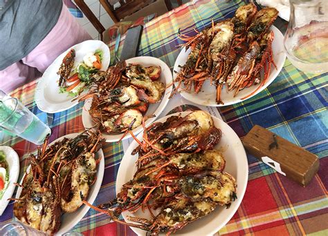 enjoying a lobster feast at sunset bay club lobster palace in dominica