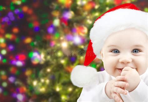 Happy Baby In Santa Hat Over Christmas Lights Stock Image Image Of