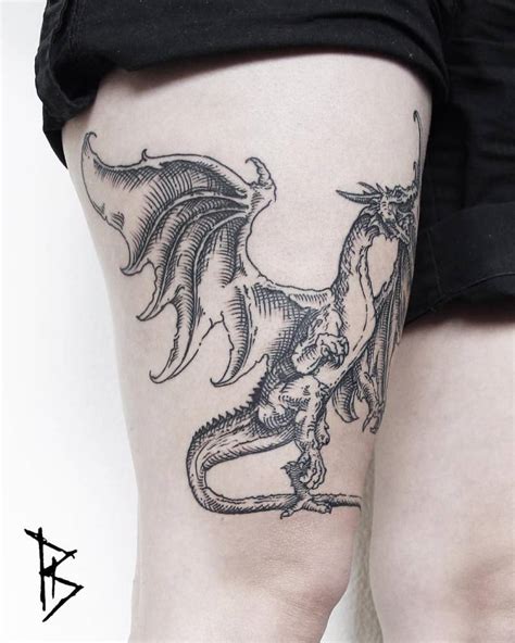 They take it as a symbol of honor and courage. Engraving style dragon tattoo on the right thigh.
