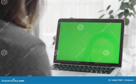 Over The Shoulder Shot Of Asian Woman Looking At Green Screen Stock