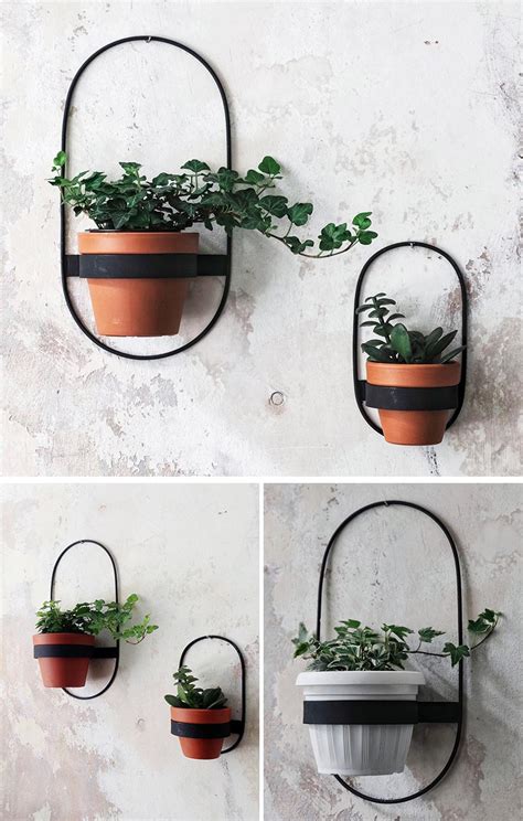 Add candles, beads, flowers, candy—whatever you can dream up for favors or table decor. Modern Black Wall Planters With Geometric Designs