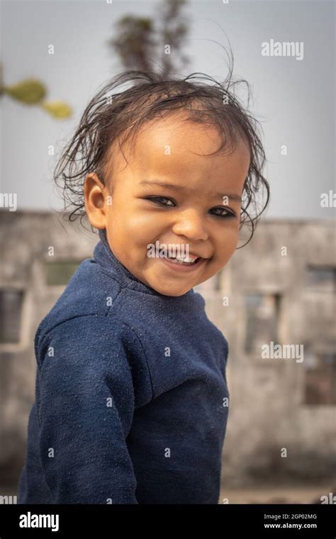 Small Kid Cute Smiling Face Close Up Shot From Flat Angle Stock Photo