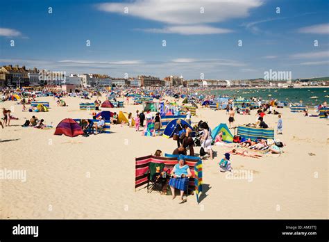 People On The Crowded Busy Seaside Beach On A Hot Summer Day Stock
