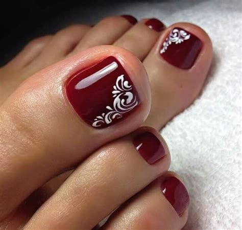 Simple Red Burgundy Toe Nails With Swirl Accent Toenail Art Designs