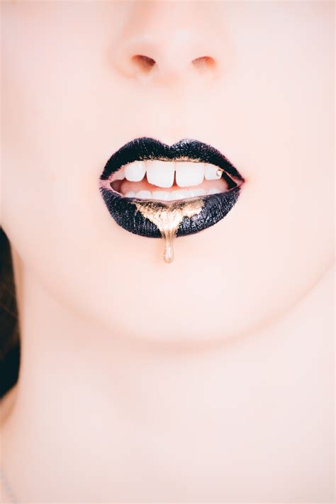 Free Photo Woman Wearing Black Lipstick With Gold Dripping Out Close Up Person Woman Free