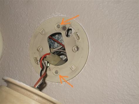 Disconnect the wires and unscrew the mounting plate from the junction box. Replacing Electric Smoke Detectors - 110-Volt Hardwired ...