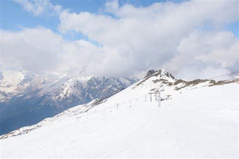 Ski Resort In The Caucasus Mountains Sunny Day In Winter Snow Slopes