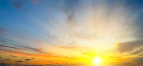 Cloudy Sky And Bright Sunrise Over The Horizon Wide Photo Stock Photo