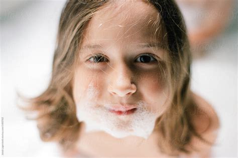 Cute Young Girl With Suds On Her Face By Jakob Lagerstedt