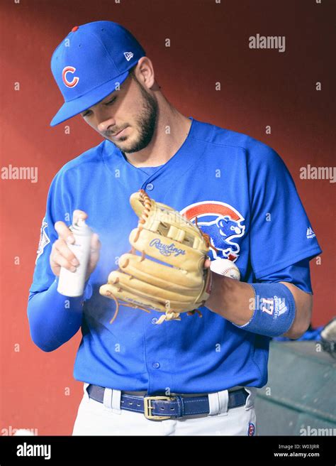 Chicago Cubs Kris Bryant Sprays Some Solvent On His Glove Before The Cubs Arizona Diamondbacks