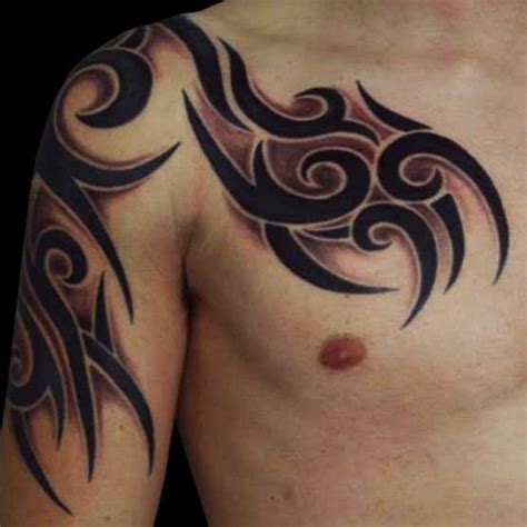 Captivating black curvy lines tribal chest tattoo designs for boys and men. 30 Best Tribal Tattoos for Men