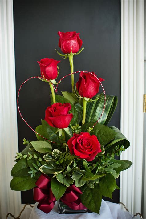 A Stunning And Unique Valentines Day Arrangement Created With Red Roses Greenery An Rose