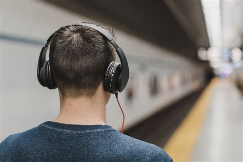 Man Listening Music On His Headphones · Free Stock Photo
