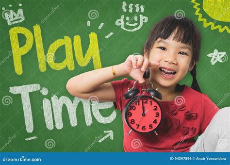 Little Girl Is Holding A Clock For Playtime Stock Photo Image Of