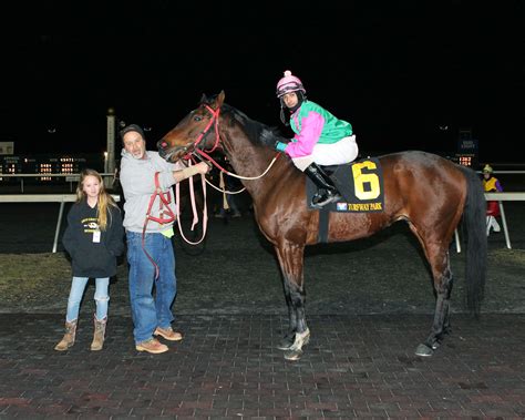 Twelve-year-old thoroughbred owner Hannah Schlenk reaches the winner’s