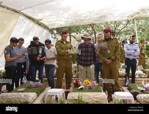 Israeli Soldiers Stand By The Graves Of Fallen Soldiers In The Mt