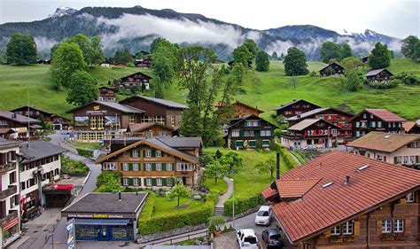 Wallpaper Switzerland Grindelwald Mountain Fields Trees Houses